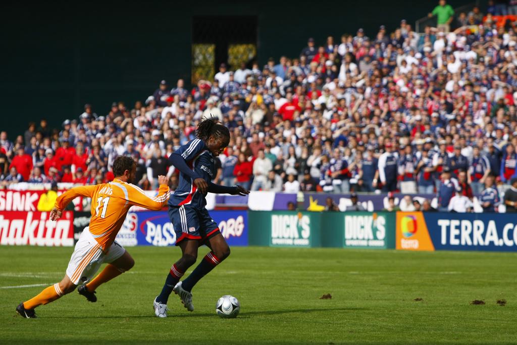 Shalrie Joseph and the Revolution do battle with the Houston Dynamo in the SuperLiga final on tuesday night.<br><i>Photo: Aaron Watson</i>